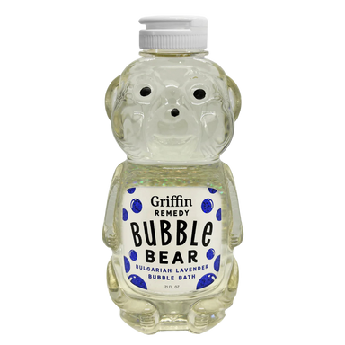 A bottle designed to resemble a bear, labeled 'Griffin Remedy Bubble Bear Bulgarian Lavender Bubble Bath', filled with a translucent liquid. Natural skincare.