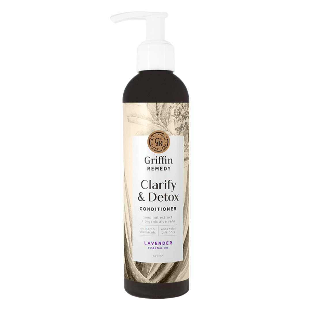 A pump bottle of Griffin Remedy Clarify & Detox Conditioner with a label featuring botanical illustrations and text indicating the product name and scent. Natural hair care.