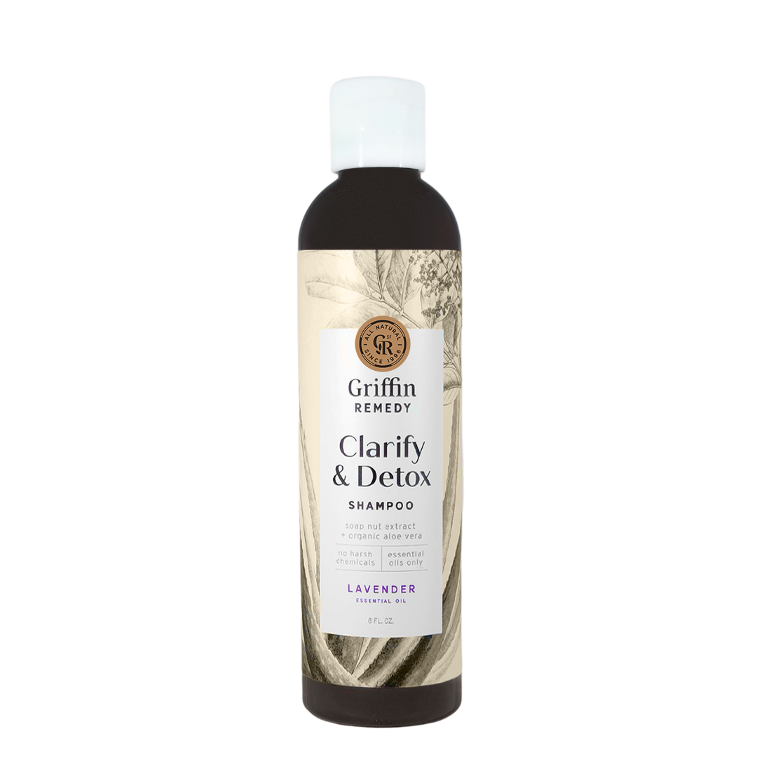 A bottle of Griffin Remedy Clarify & Detox Shampoo with a label featuring botanical illustrations and text indicating the product is lavender scented. Natural hair care.