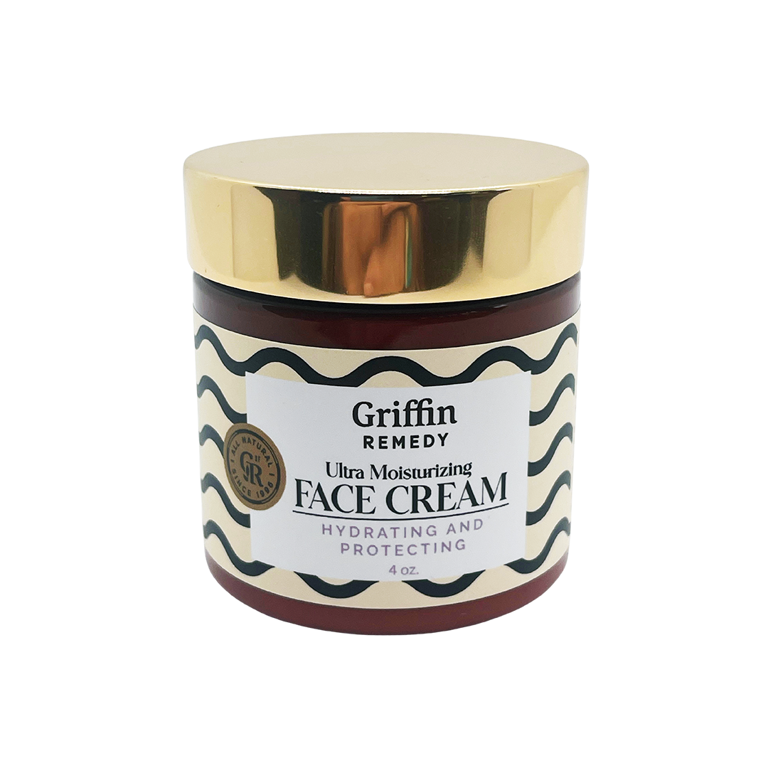 A jar of Griffin Remedy Ultra Moisturizing Face Cream with a gold lid and label that reads 'Hydrating & Protecting'. Natural skincare.