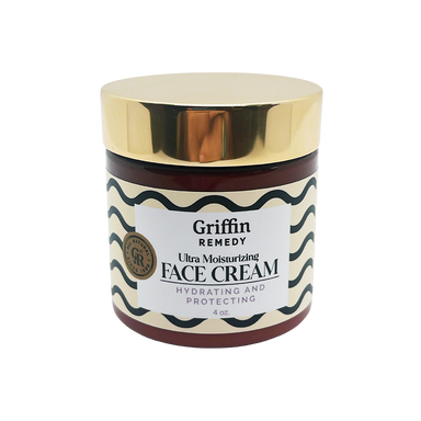 A jar of Griffin Remedy Ultra Moisturizing Face Cream with a gold lid and label that reads 'Hydrating & Protecting'. Natural skincare.