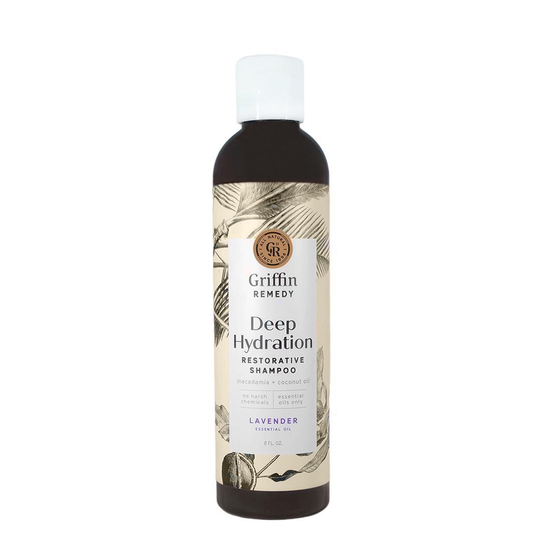 A bottle of Griffin Remedy Deep Hydration Restorative Shampoo with a label featuring botanical illustrations and text indicating the product name and type, lavender-scented. Natural hair care.