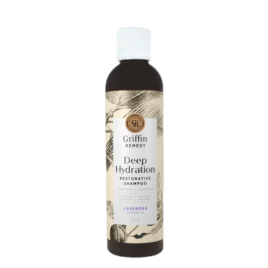 A bottle of Griffin Remedy Deep Hydration Restorative Shampoo with a label featuring botanical illustrations and text indicating the product name and type, lavender-scented. Natural hair care.