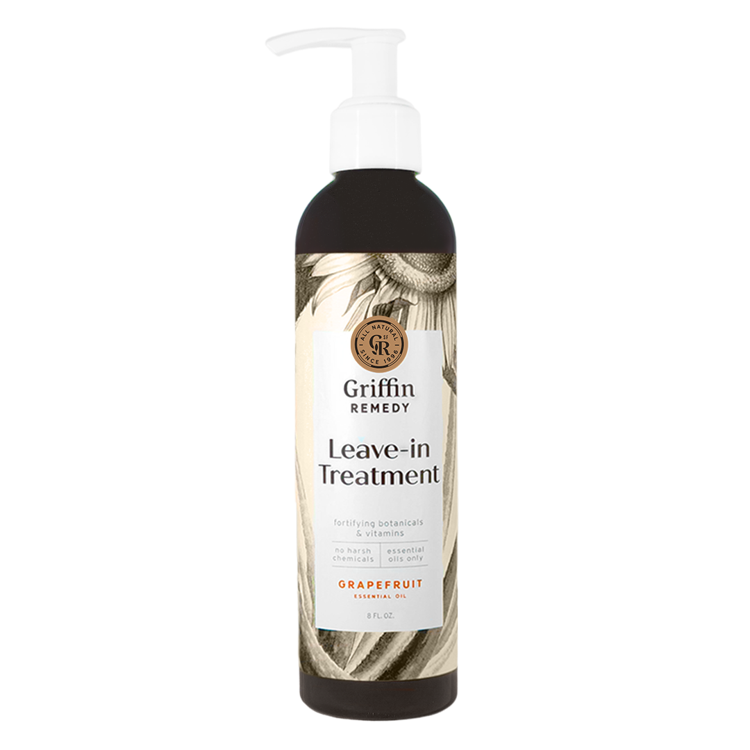 A pump bottle of Griffin Remedy Leave-In Treatment with a label featuring botanical designs. Natural hair care.