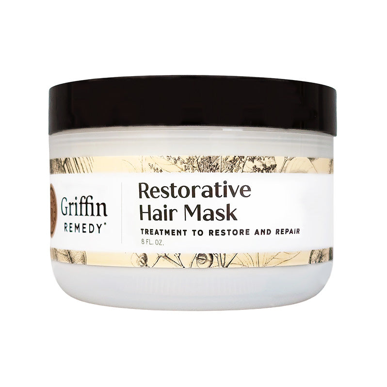 A white jar with a black lid labeled 'Griffin Remedy Restorative Hair Mask' with additional text stating it is a treatment to restore and repair hair. Natural hair care.