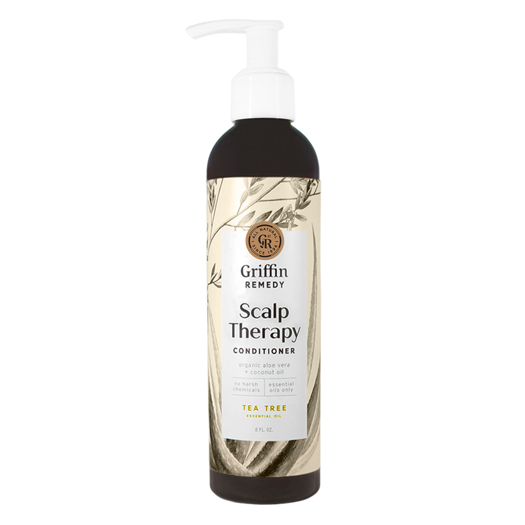 A pump bottle of Griffin Remedy Scalp Therapy Conditioner with Tea Tree scent, featuring a label with botanical illustrations. Natural hair care.