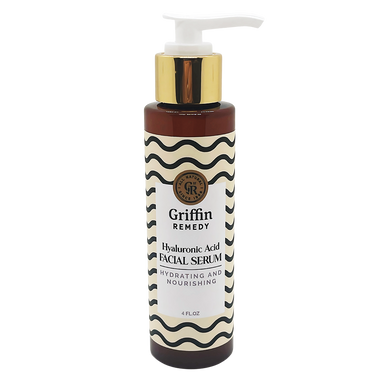 A bottle of Griffin Remedy Hyaluronic Acid Facial Serum with a pump dispenser. The label has a black and white striped design. Natural skincare.
