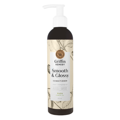 A pump bottle of Griffin Remedy Smooth & Glossy Conditioner with a label featuring botanical illustrations. Natural hair care.
