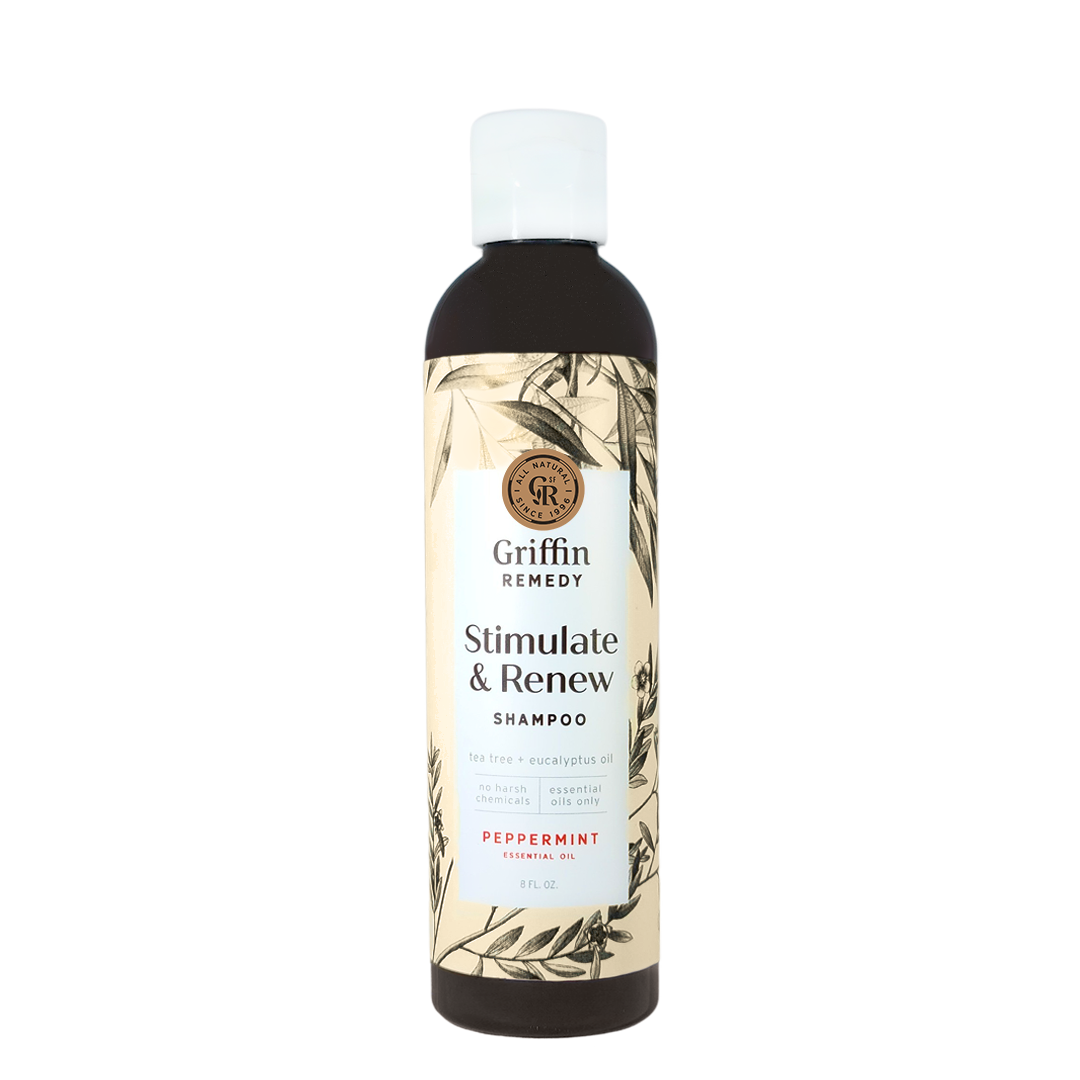 A bottle of Griffin Remedy Stimulate & Renew Shampoo with a label featuring botanical illustrations and text indicating the scent as Peppermint. Natural hair care.
