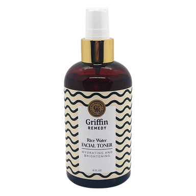 A spray bottle of Griffin Remedy Rice Water Facial Toner with a label featuring a geometric pattern. Natural skincare.