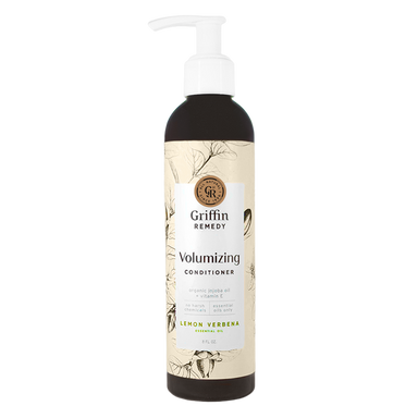 A pump bottle of Griffin Remedy Volumizing Conditioner with a label featuring botanical illustrations and text. Natural hair care.