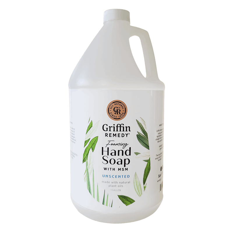 A gallon-sized container of Griffin Remedy Foaming Hand Soap with MSM, Unscented, featuring a white label with green leaf designs. Natural soap.