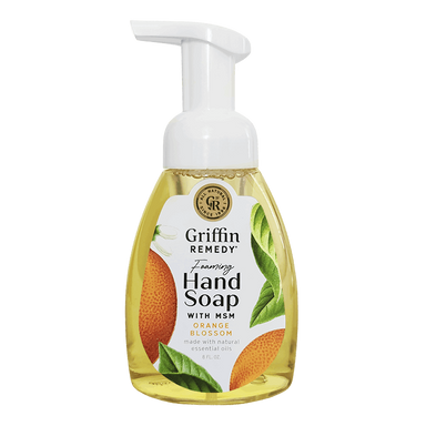 A pump bottle of Griffin Remedy Foaming Hand Soap with orange blossom design elements on the label. Natural soap.