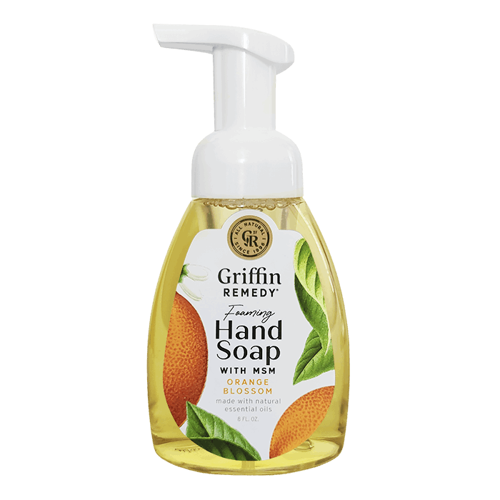 A pump bottle of Griffin Remedy Foaming Hand Soap with orange blossom design elements on the label. Natural soap.