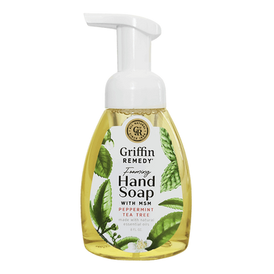 A pump bottle of Griffin Remedy Foaming Hand Soap with Peppermint Tea Tree. The label shows green and white colors with leaf patterns and the soap appears to be a clear liquid. Natural soap.