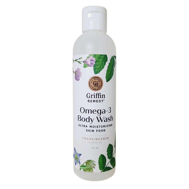 A bottle of Griffin Remedy Omega-3 Creamy Body Wash with a label featuring botanical illustrations and text indicating the product name and type. Natural skincare.