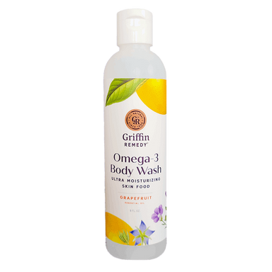 A bottle of Griffin Remedy Omega-3 Creamy Body Wash with a grapefruit scent. The label shows a lemon and leaves design with the product name and an indication of being ultra moisturizing. Natural skincare.