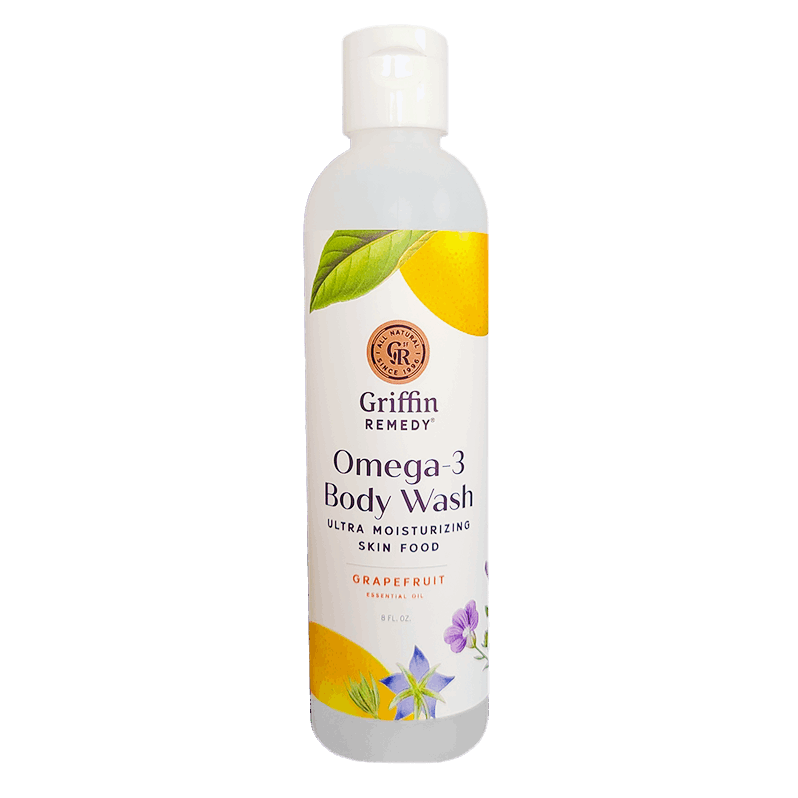 A bottle of Griffin Remedy Omega-3 Creamy Body Wash with a grapefruit scent. The label shows a lemon and leaves design with the product name and an indication of being ultra moisturizing. Natural skincare.