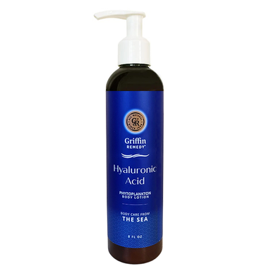 A pump bottle of Griffin Remedy Hyaluronic Acid body lotion with a blue label and dark liquid visible through the bottle. Natural skincare.