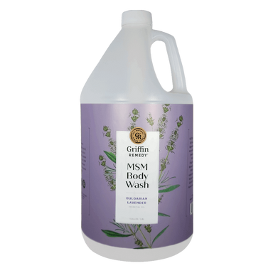 A gallon-sized bottle of Griffin Remedy MSM Body Wash with Bulgarian Lavender essential oils. The bottle is white with a label featuring lavender plants and purple accents. Natural skincare.