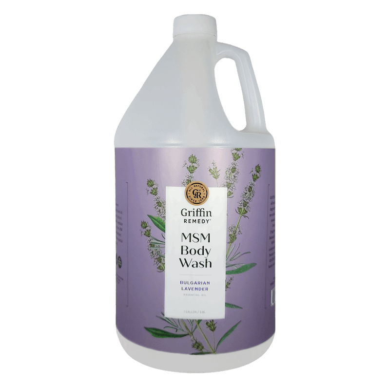 A gallon-sized bottle of Griffin Remedy MSM Body Wash with Bulgarian Lavender essential oils. The bottle is white with a label featuring lavender plants and purple accents. Natural skincare.
