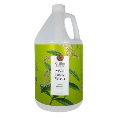 A gallon-sized bottle of Griffin Remedy MSM Body Wash with a green label featuring lemon verbena plants. Natural skincare.