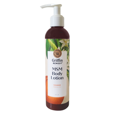 A pump bottle of Griffin Remedy MSM Body Lotion with Orange Blossom scent, featuring a label with orange flowers and product information. Natural skincare.