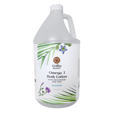 A gallon-sized bottle of Griffin Remedy Omega-3 Body Lotion with a label featuring botanical illustrations. Natural skincare.