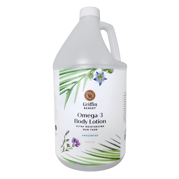A gallon-sized bottle of Griffin Remedy Omega-3 Body Lotion with a label featuring botanical illustrations. Natural skincare.