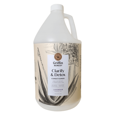 A gallon-sized container of Griffin Remedy Clarify & Detox Conditioner with a label featuring a monochrome floral design and the product name. Natural hair care.
