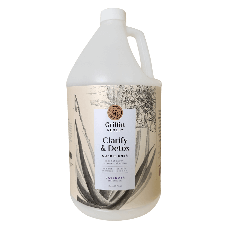 A gallon-sized container of Griffin Remedy Clarify & Detox Conditioner with a label featuring a monochrome floral design and the product name. Natural hair care.