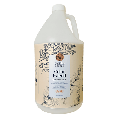 A gallon-sized bottle of Griffin Remedy Color Extend Conditioner with a design featuring botanical illustrations. Natural hair care.