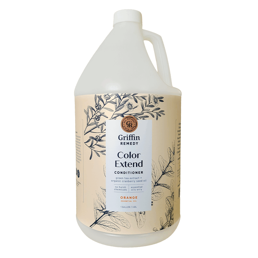 A gallon-sized bottle of Griffin Remedy Color Extend Conditioner with a design featuring botanical illustrations. Natural hair care.