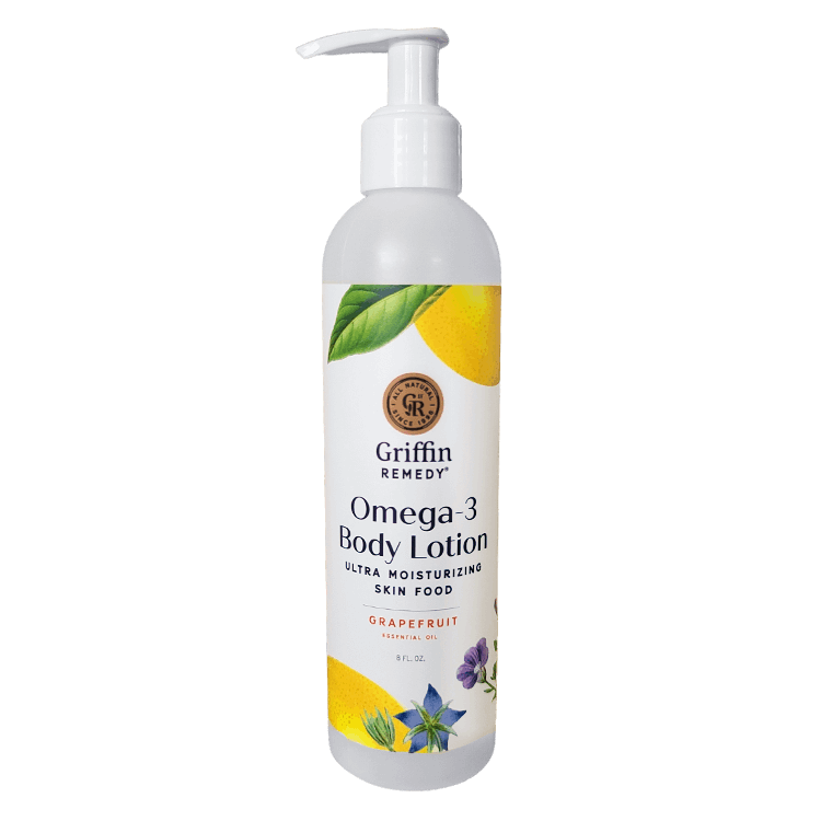 A pump bottle of Griffin Remedy Omega-3 Body Lotion with grapefruit body lotion. The label includes a image of a grapefruit and other botanicals. Natural skincare.