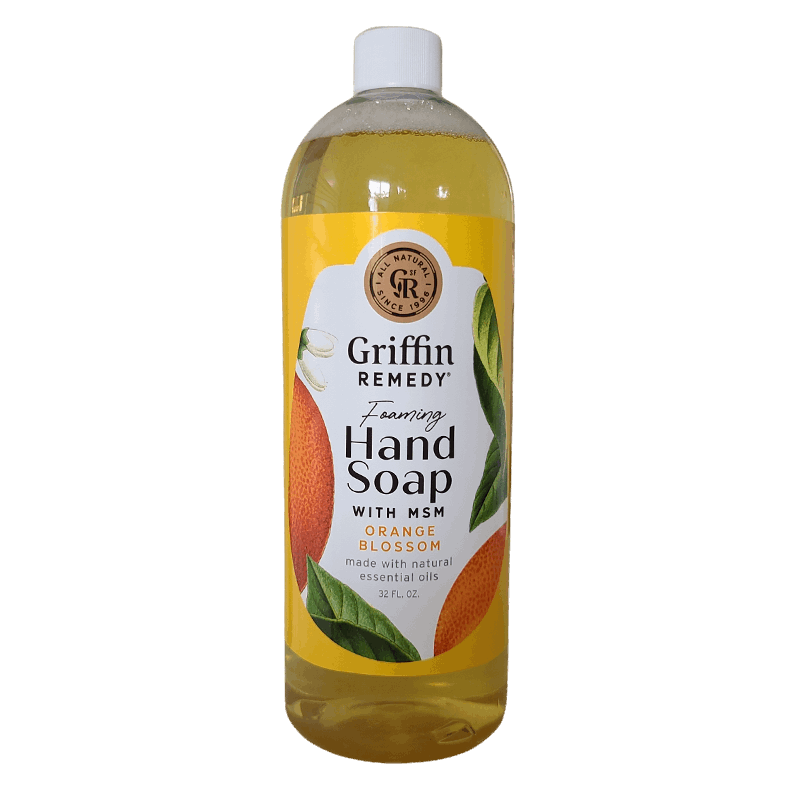 A pump bottle of Griffin Remedy Foaming Hand Soap with orange blossom design elements on the label. Natural soap.