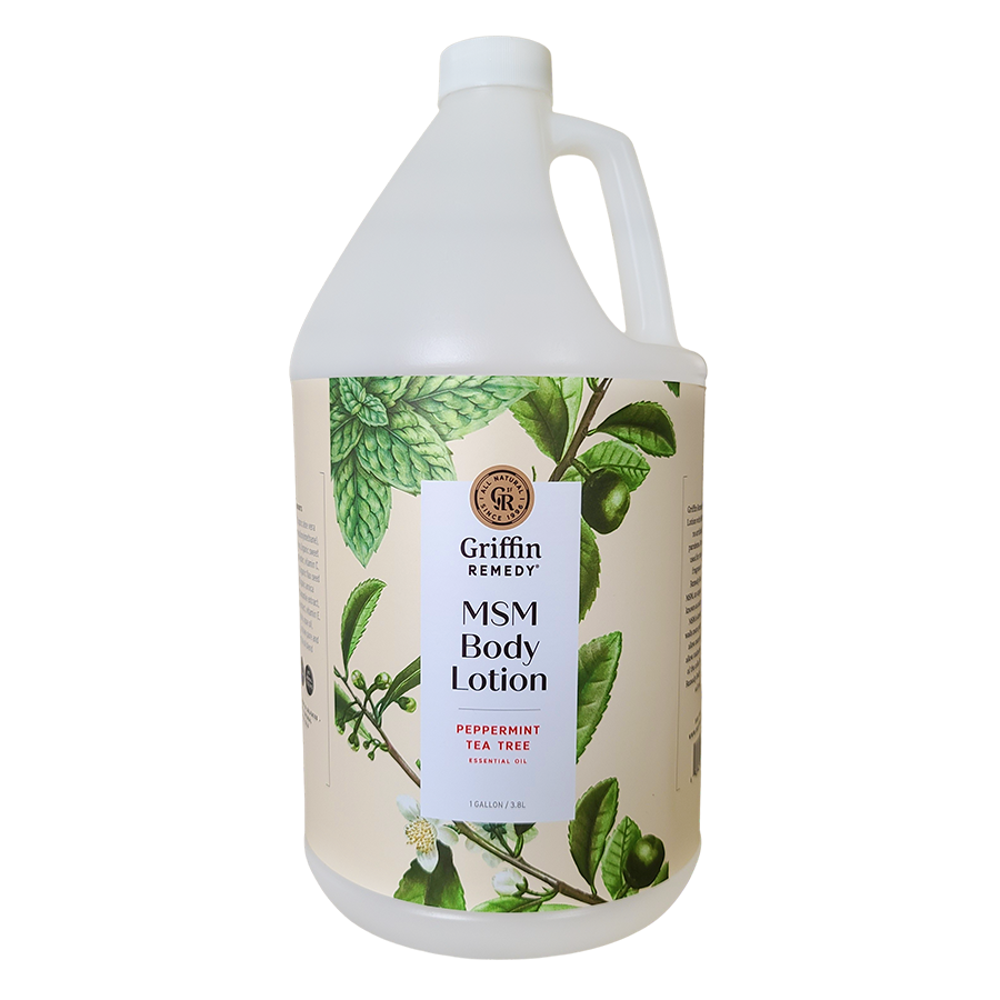 A gallon-sized bottle of Griffin Remedy MSM Body Lotion with Peppermint and Tea Tree essential oils. The bottle is white with a label featuring green botanical illustrations and text. Natural skincare.