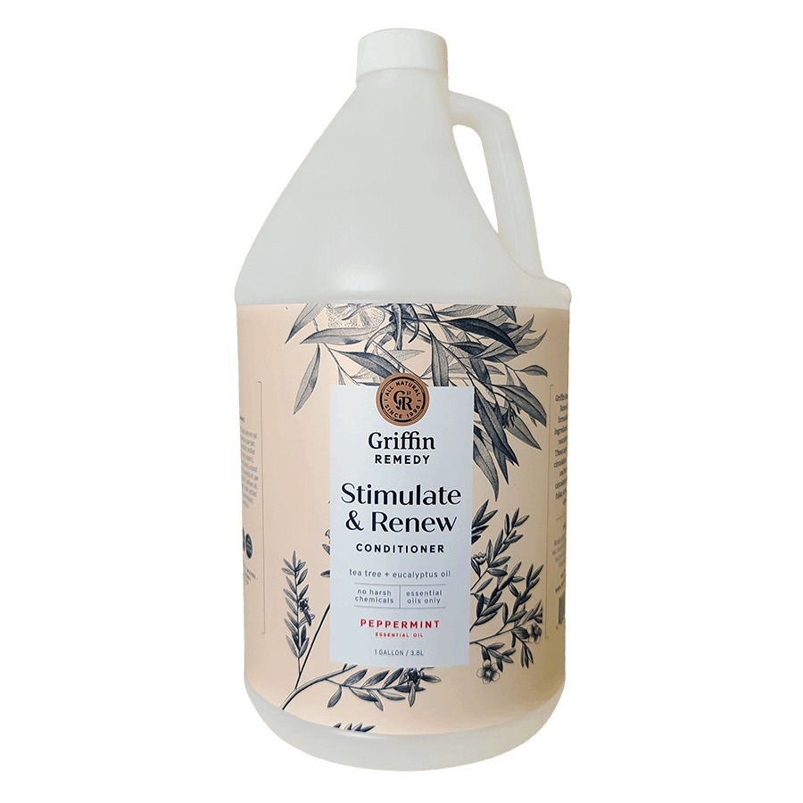 A gallon bottle of Griffin Remedy Stimulate & Renew Conditioner with a label featuring botanical illustrations and text indicating the product name and scent. Natural hair care.