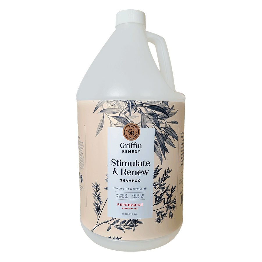 A gallon bottle of Griffin Remedy Stimulate & Renew Shampoo with a label featuring botanical illustrations and text indicating the scent as Peppermint. Natural hair care.