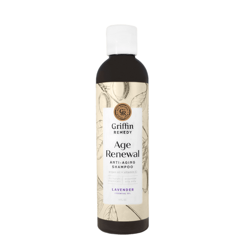 A bottle of Griffin Remedy Age Renewal Anti-Aging Shampoo with a lavender label. Natural hair care.