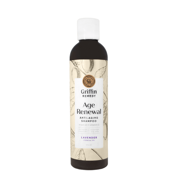 A bottle of Griffin Remedy Age Renewal Anti-Aging Shampoo with a lavender label. Natural hair care.