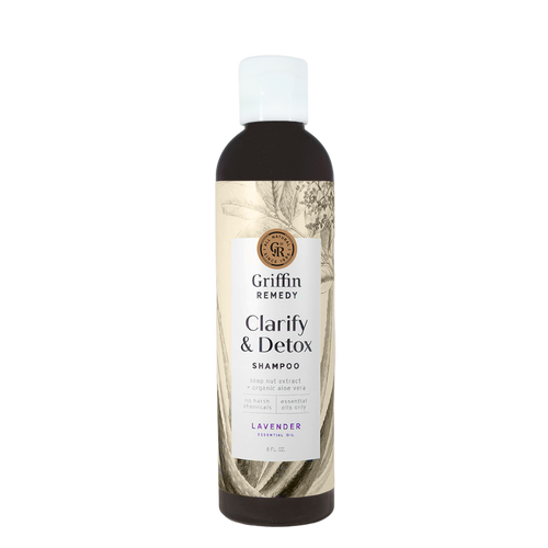 A bottle of Griffin Remedy Clarify & Detox Shampoo with a label featuring botanical illustrations and text indicating the product is lavender scented. Natural hair care.