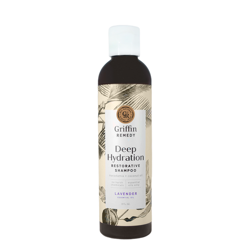 A bottle of Griffin Remedy Deep Hydration Restorative Shampoo with a label featuring botanical illustrations and text indicating the product name and type, lavender-scented. Natural hair care.