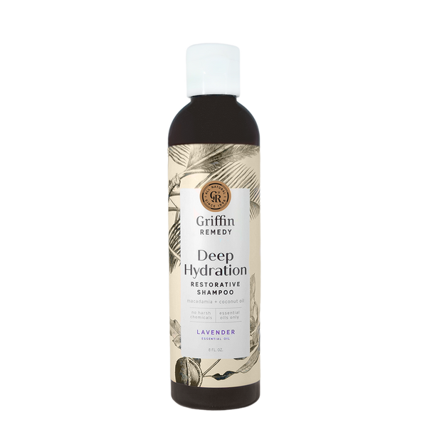 A bottle of Griffin Remedy Deep Hydration Restorative Shampoo with a label featuring botanical illustrations and text indicating the product name and type, lavender-scented. Natural hair care.