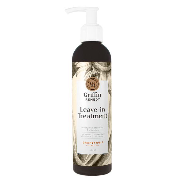 A pump bottle of Griffin Remedy Leave-In Treatment with a label featuring botanical designs. Natural hair care.