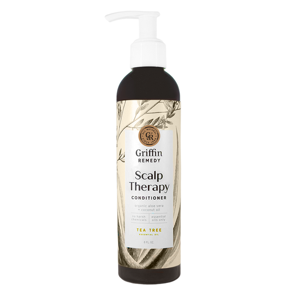 A pump bottle of Griffin Remedy Scalp Therapy Conditioner with Tea Tree scent, featuring a label with botanical illustrations. Natural hair care.