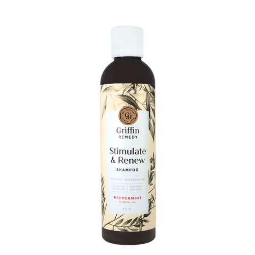 A bottle of Griffin Remedy Stimulate & Renew Shampoo with a label featuring botanical illustrations and text indicating the scent as Peppermint. Natural hair care.