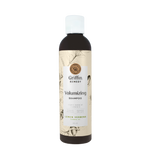 A bottle of Griffin Remedy Volumizing Shampoo with a label featuring botanical illustrations and text indicating the product name and scent, Lemon Verbena. Natural hair care.
