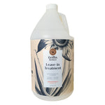 A gallon bottle of Griffin Remedy Leave-In Treatment with a label featuring botanical designs. Natural hair care.