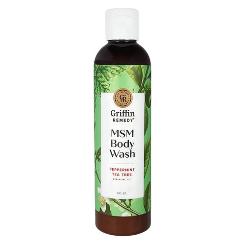 A bottle of Griffin Remedy MSM Body Wash with Peppermint Tea Tree. The label shows a green and white design with botanical elements and the product information. Natural skincare.