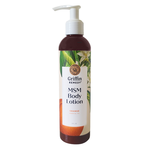 A pump bottle of Griffin Remedy MSM Body Lotion with Orange Blossom scent, featuring a label with orange flowers and product information. Natural skincare.